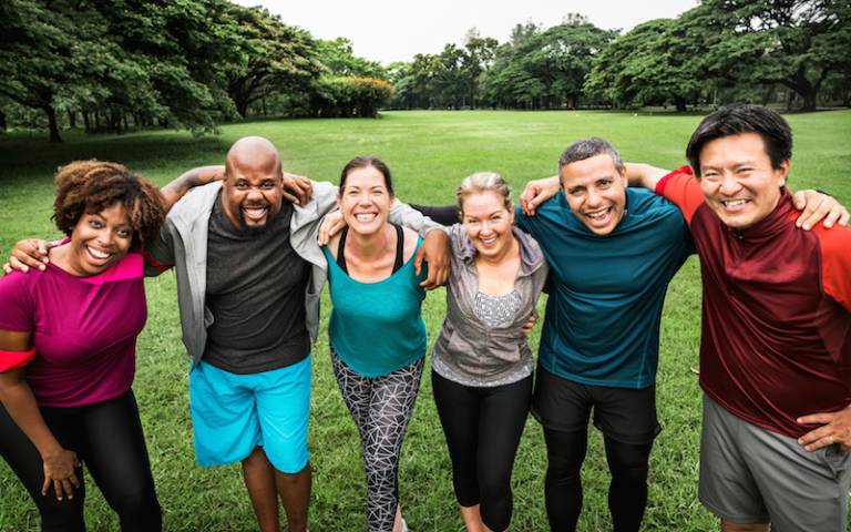 Group of smiling people wearing exercise clothes - photo from Shutterstock