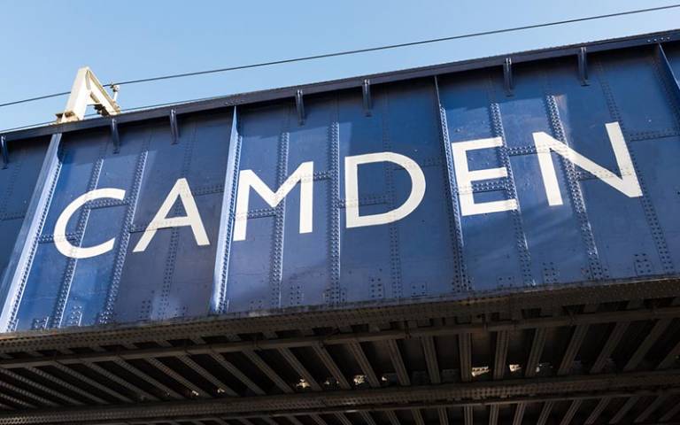 The word 'Camden' written across a railway bridge