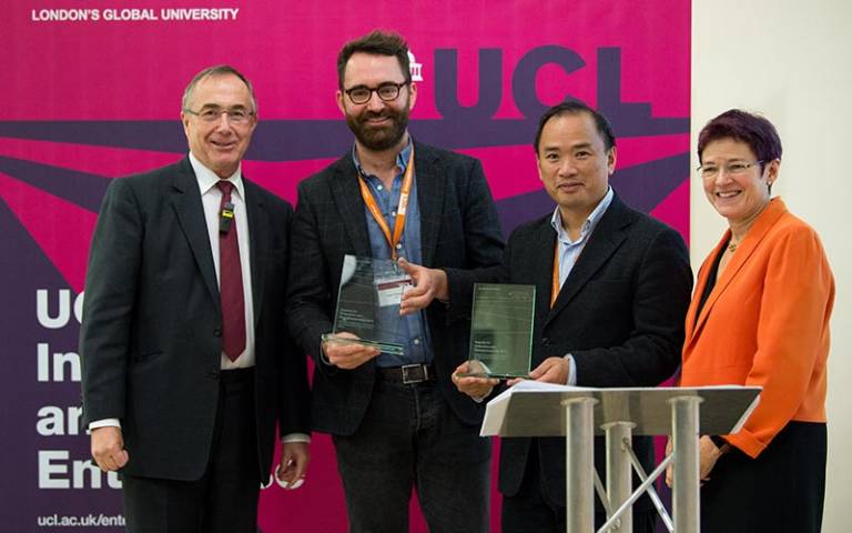 Dr Robert Thompson and Dr Kenneth Tong collect their award from President and Provost Michael Arthur and Dr Celia Caulcott, Vice-Provost (Enterprise)