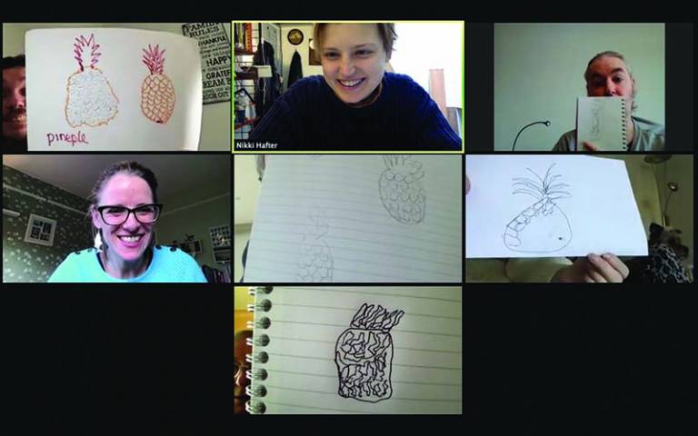 An online video call with people showing their artwork to the camera