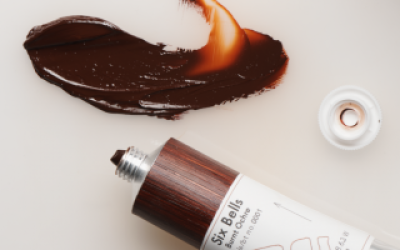 A tube of brown coloured paint