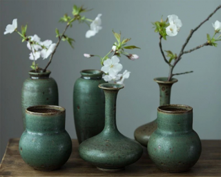 A selection of green vases