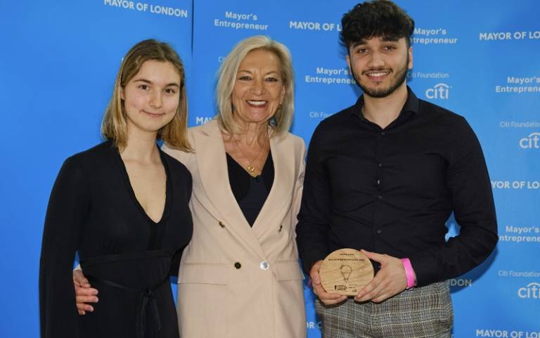 upLYFT founders Zuzanna Kosobudzka and Aalok Rai with one of the competition judges