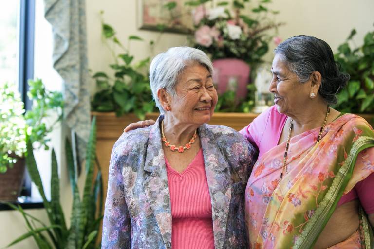 Two older women laughing together