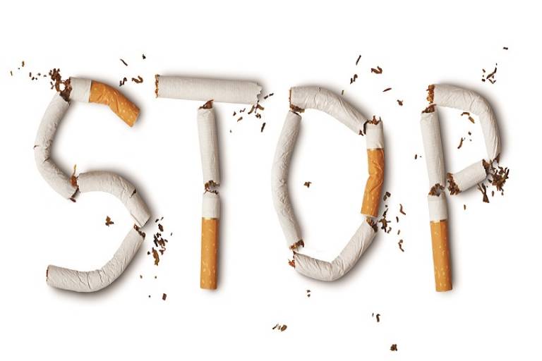 the word 'stop' formed using cigarettes