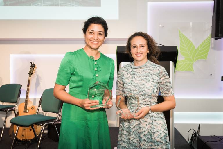 Photograph of Rashmi Mathew and Christin Henein with their awards