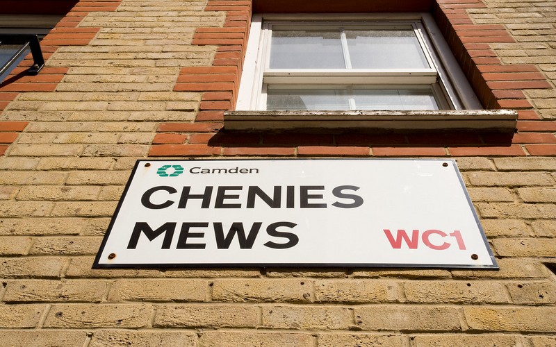 a UK road name plate saying 'Chenies Mews WC1'