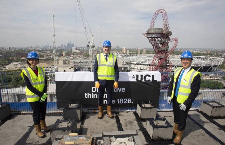 Left to right; Prof Paula Lettieri, Mr Kevin Argent Director UCL Development, and Dr Michael Spence Provost UCL stand on the top floor of Marshgate with Arcelor Mittal in the background