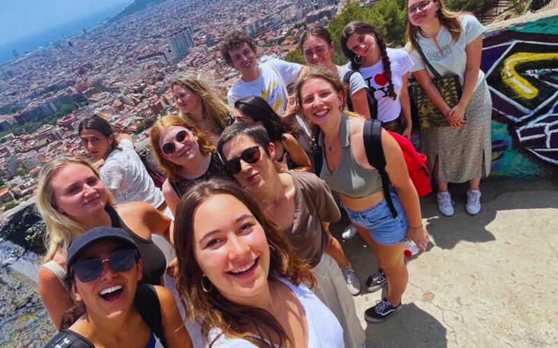 Group of students taking selfie over Barcelona