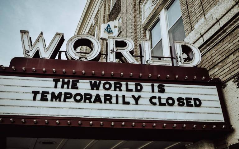 the world is closed cinema sign