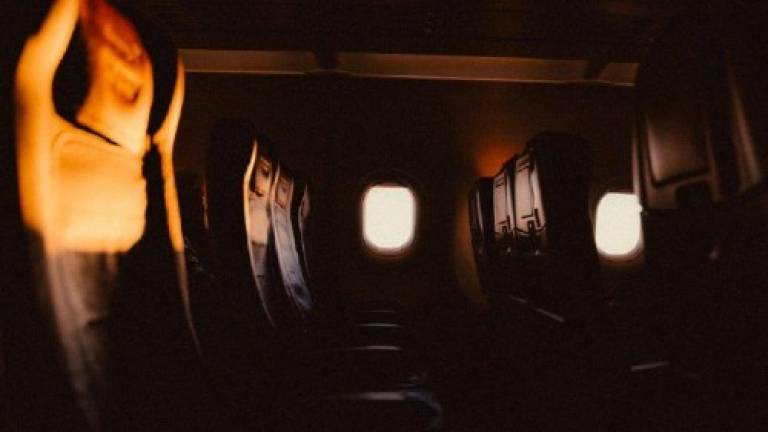 Photo of a row of empty seats on an aeroplane