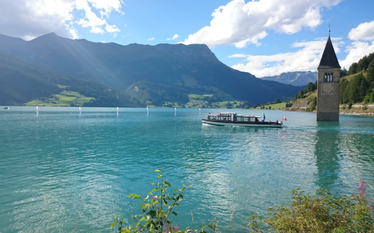 Reschensee with church tower in Vinschgau, South Tyrol