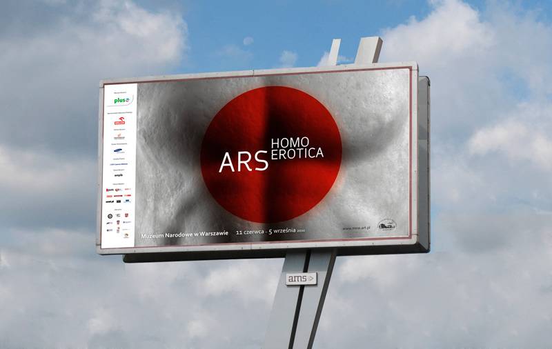 A large billboard in front of a blue, cloudy sky. The billboard has a gray background with a red circle and white text reading "ARS homo erotica." On the lefthand side of the billboard is a list of sponsor logos, too small to read. 