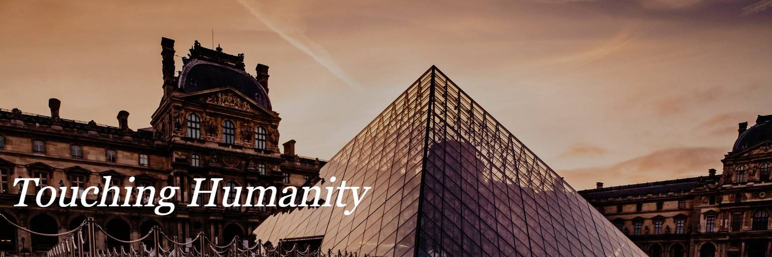 A photo of the Louvre museum in Paris at dusk, with italicized white text reading "Touching Humanity"