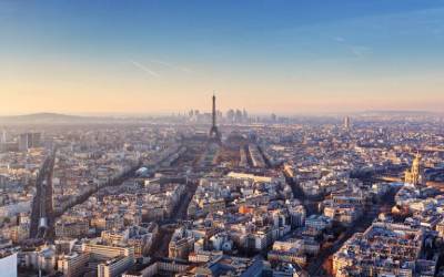 A skyline photo of Paris with the Eiffel Tower visible