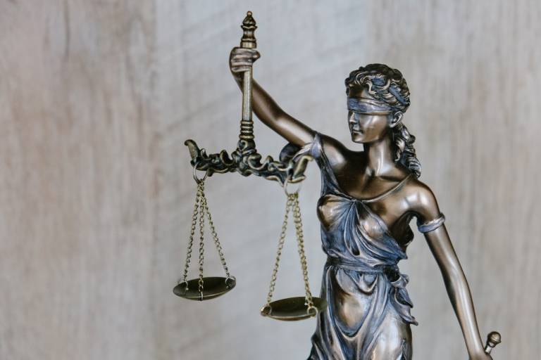 Image of scales of justice with the lady blindfolded