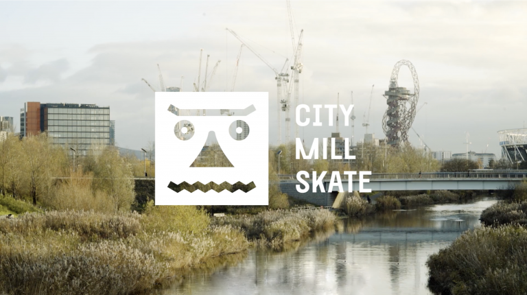 City Mill Skate white logo in front of the Olympic Park in East London