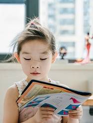Girl reading magazine