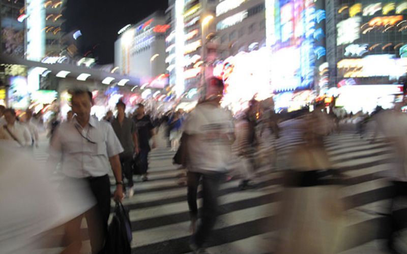 Blurred photo of people on the Shibuya crossing in Tokyo, Japan