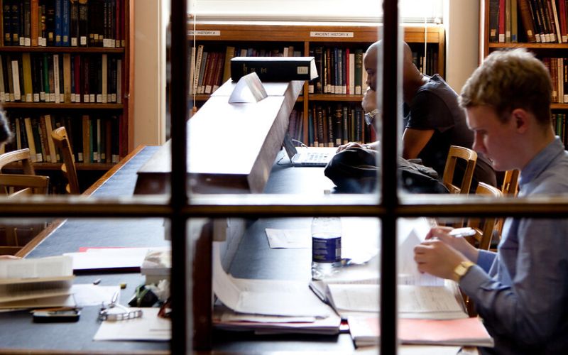Students studying in the main UCL Library