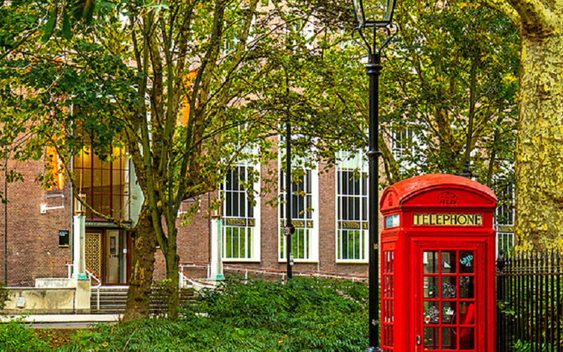 Exterior of UCL School of Pharmacy with red phone box.