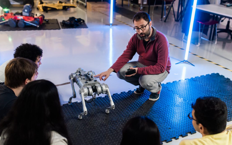Dr Dimitrios Kanoulas leads a class examining a four-legged robot.