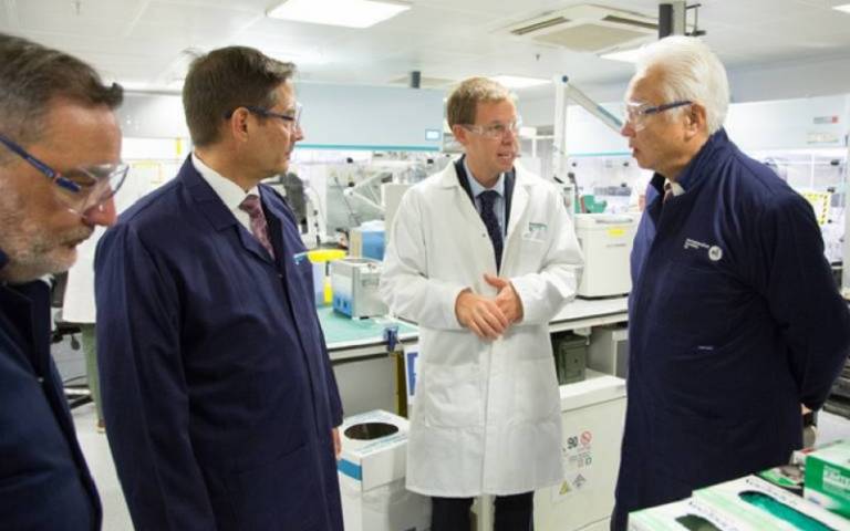 Representatives from UCL and Horiba meet in a laboratory.