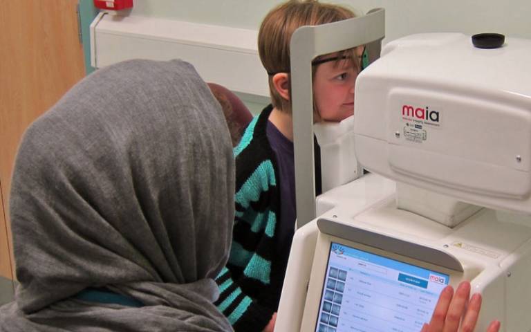 Child having eyes examined