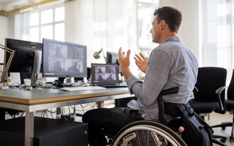 Man in a wheelchair attending a webinar