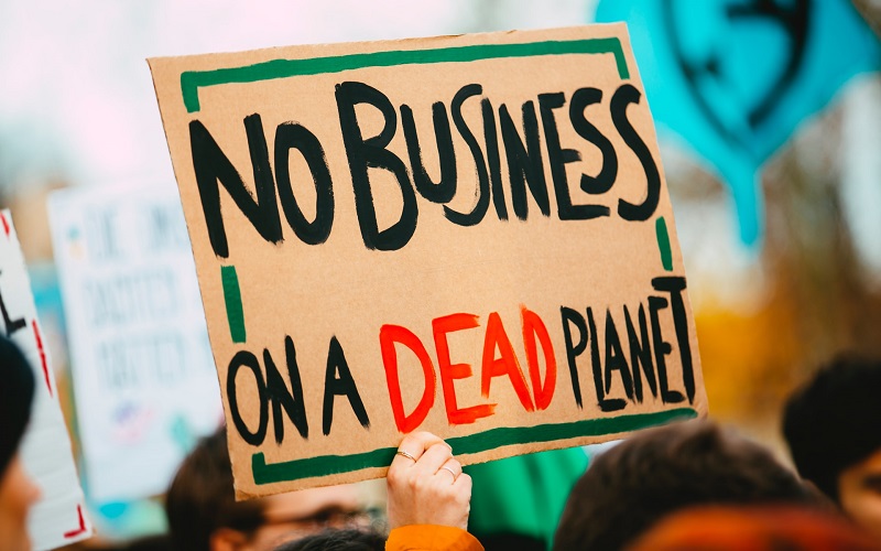 Protest Sign: No Business on a Dead Planet (Markus Spiske/Unsplash)