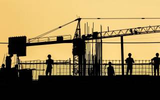 Silhouettes of construction workers