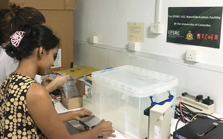 Research assistant Laura Alquezar installing the new equipment in Colombo with some of the local PhD students