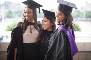 Image of three graduates at the UCL Laws graduation reception