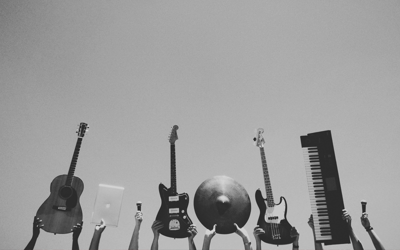 multiple musical instruments displayed in a row