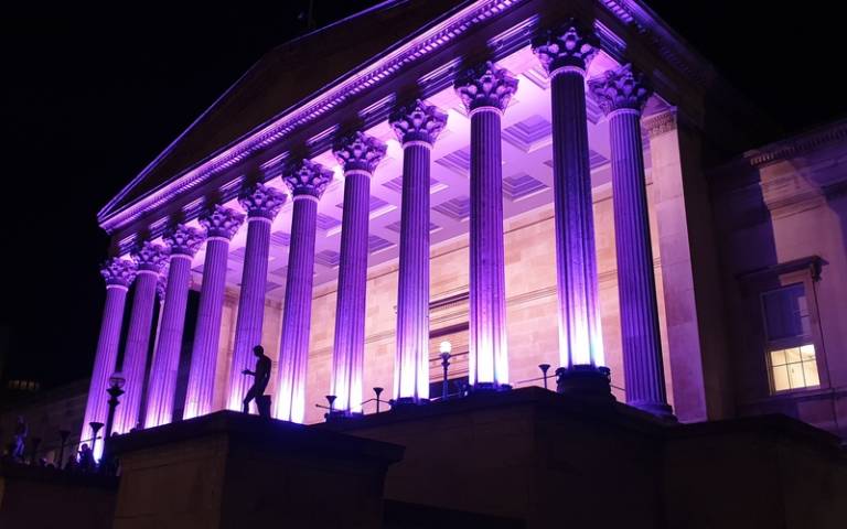 UCL cloisters lit up in colour purple