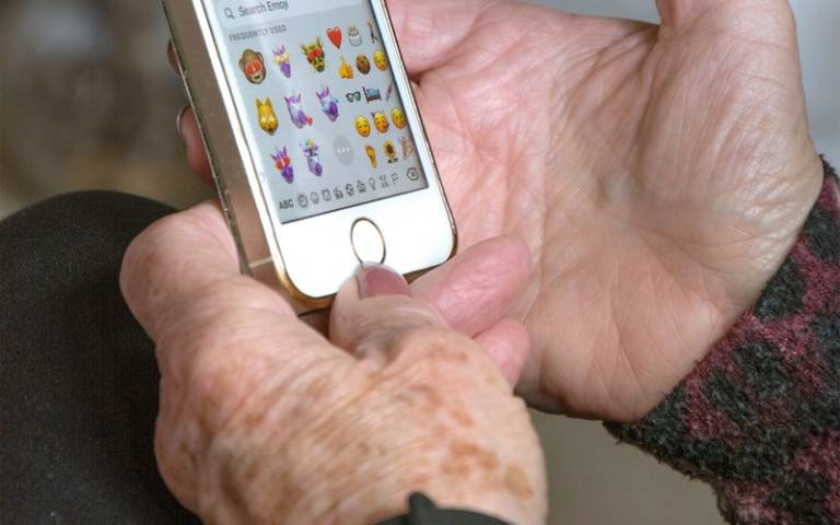 Old person holding a mobile phone