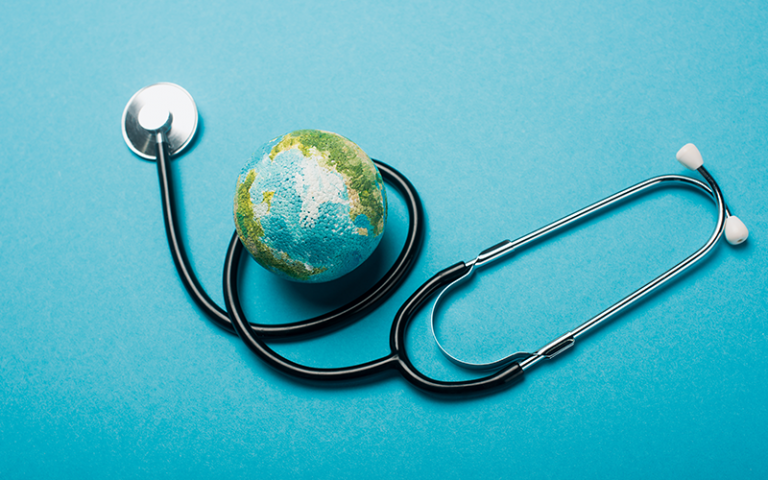 an image of a globe next to a stethoscope 