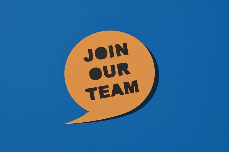 orange speech bubble with the words 'join our team' on a blue background