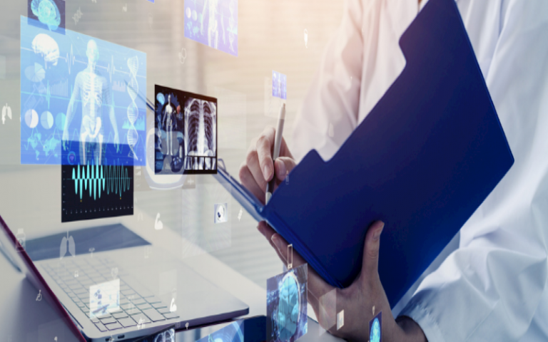 Clinician in white coat holds pen and clipboard next to computer and generated holographic medical images