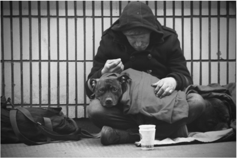 Homeless man sat with his dog