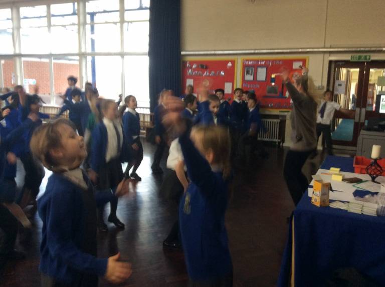 Children dancing during engagement activity