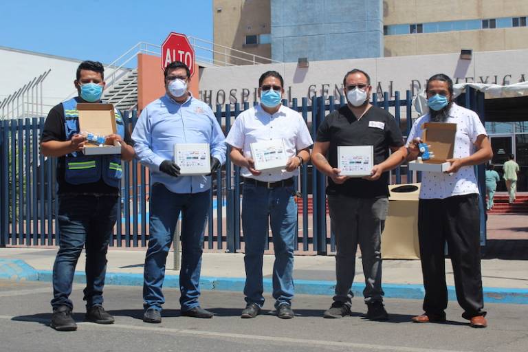 Baja Ventura members stand in front of Mexicali hospital