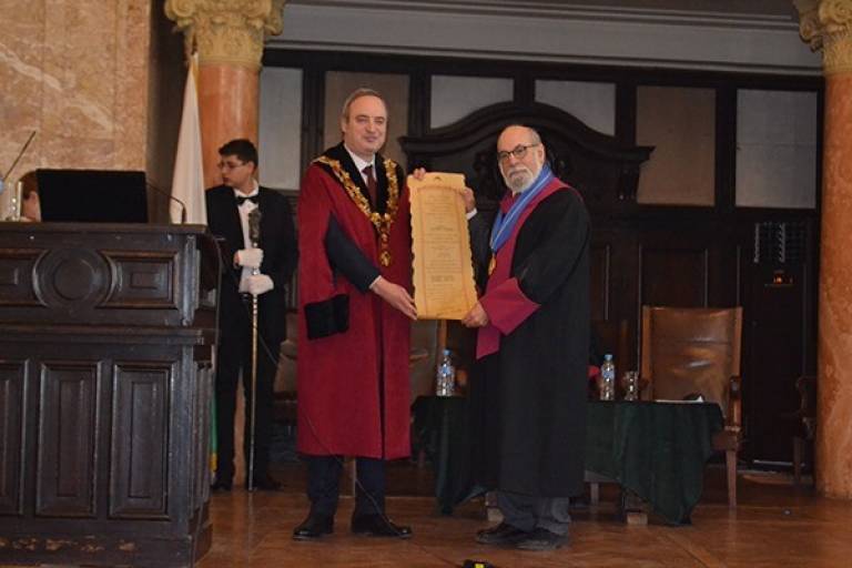 Mark Geller being handed honorary doctorate 
