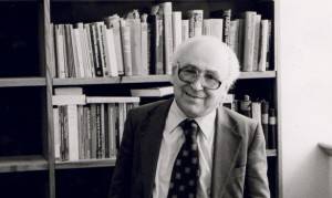 Chimen Abramsky in an office surrounded by books