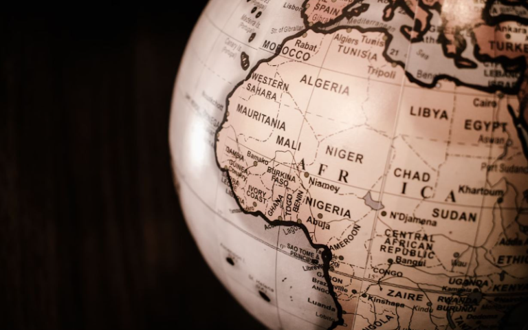 A sepia tone image of a globe showing continent of Africa