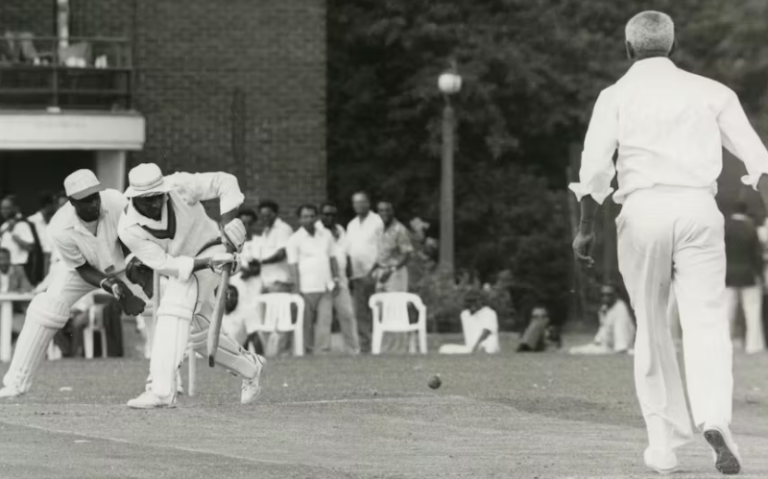 Image of windrush arrivals playing cricket - photo in black and white