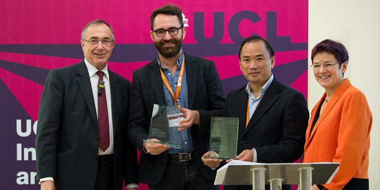 UCL Provost Michael Arthur handing awards to Drs Tong and Thompson