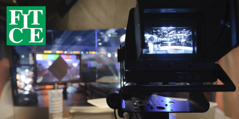 View finder of a camera in front of tv studio, with FITCE logo