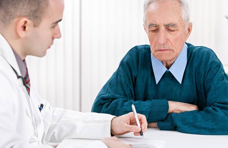 Older patient talking to doctor