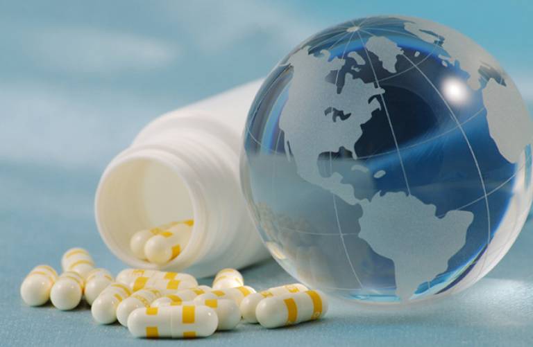 Medicine pills and a glass globe